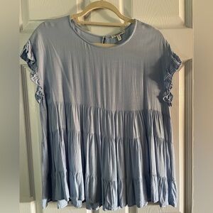 Sleeveless blue blouse / top